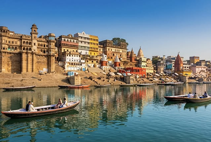 Historic Ganga ghats and pilgrims on wooden boats in Varanasi